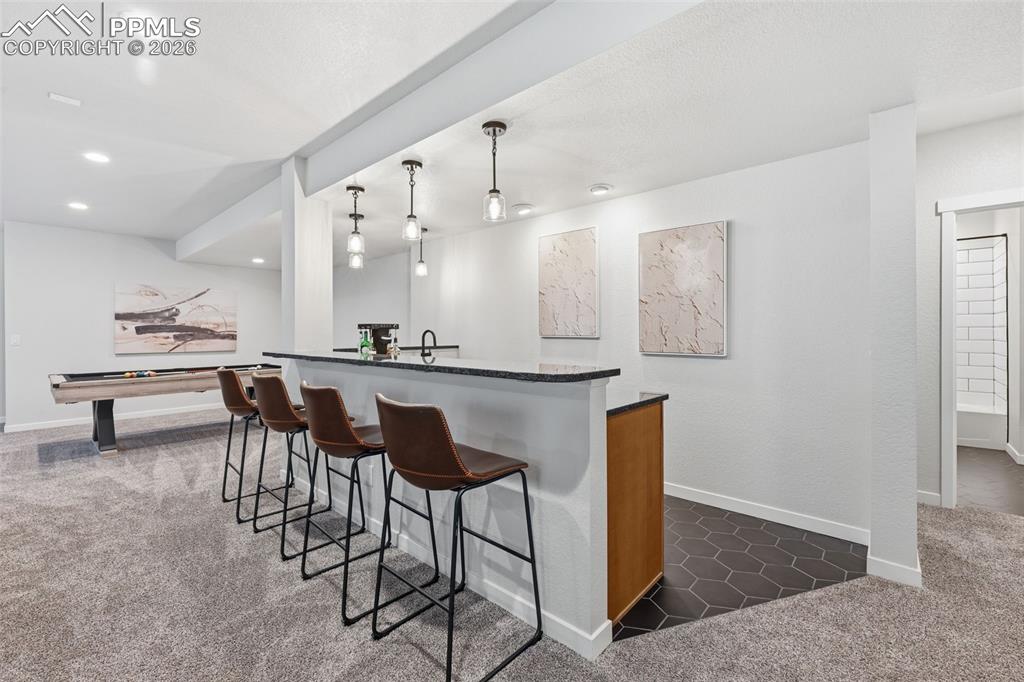 Image 35 of 46: Large customized wet bar