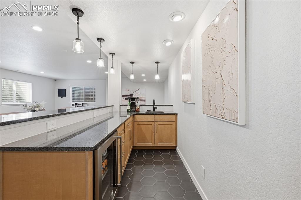 Image 36 of 46: Upgraded cabinets, tile and countertops