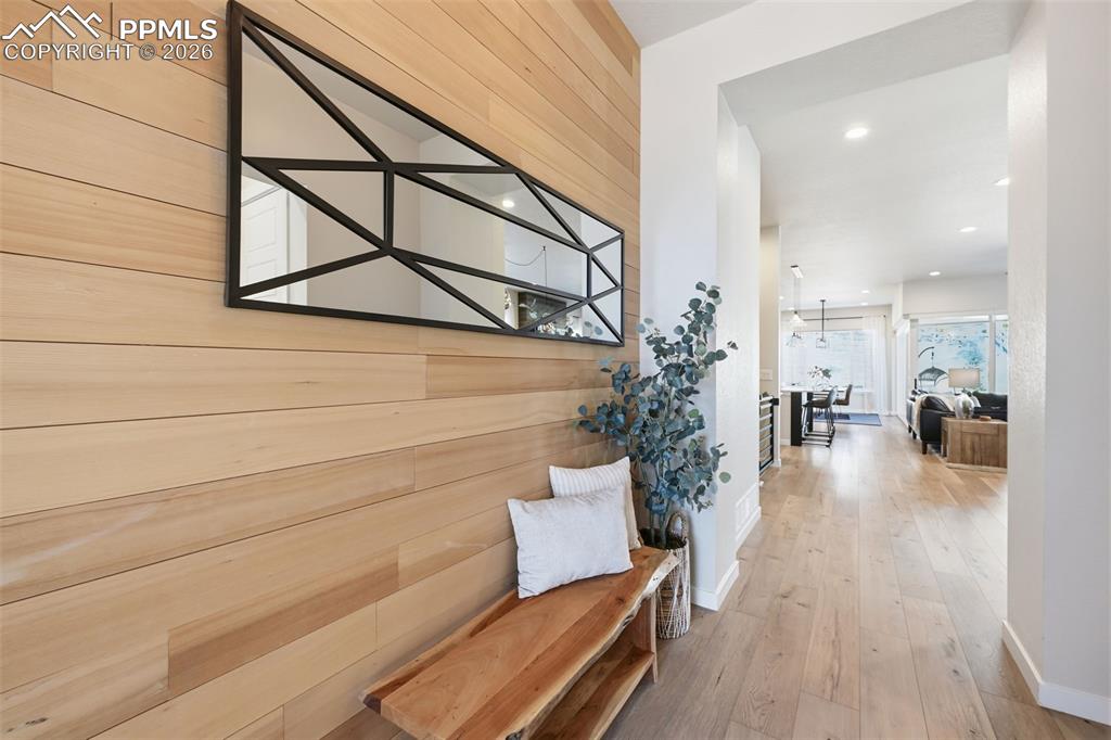 Image 5 of 46: Custom wood wall in entryway