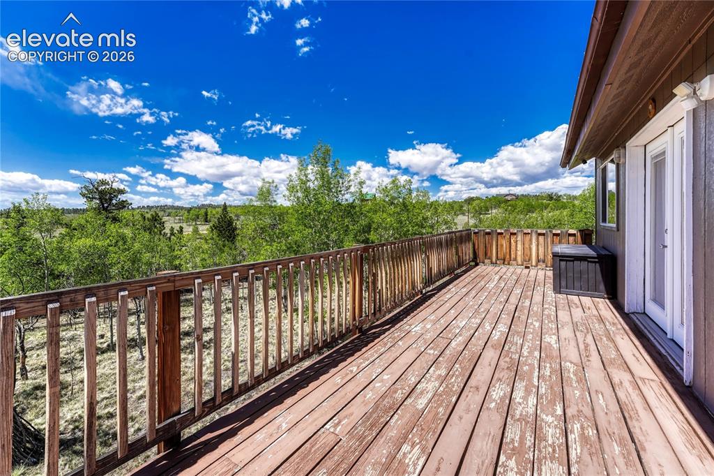 Image 26 of 50: Wrap around porch with views