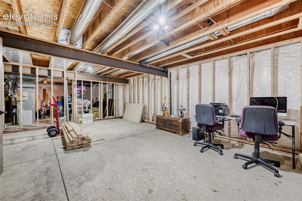 Image 25 of 29: Unfinished 15x22 basement space that has been framed and has a rough in for