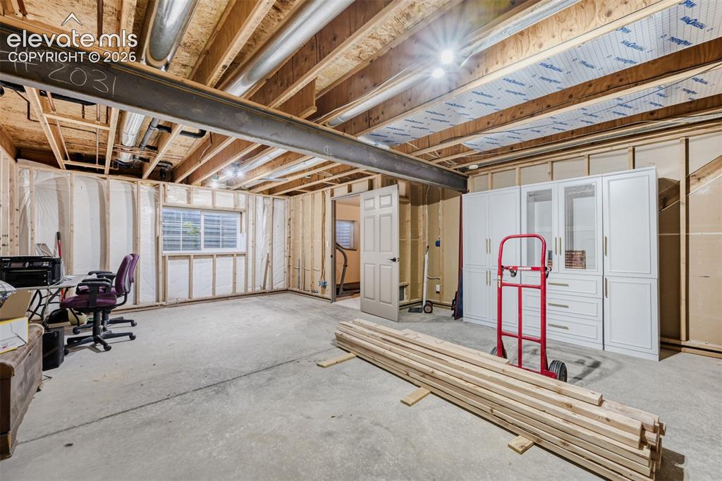 Image 26 of 29: Unfinished 15x22 basement space that has been framed and has a rough in for