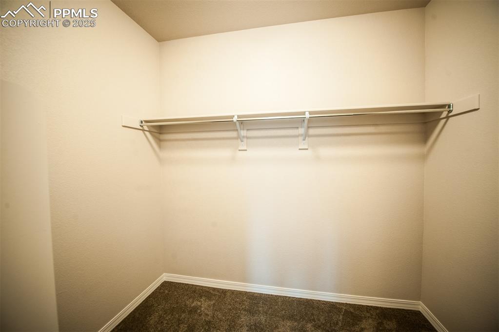 Image 25 of 29: Walk-in closet