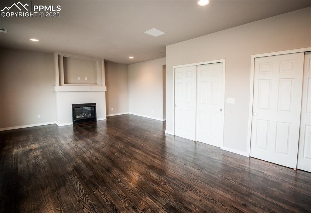 Image 4 of 29: Living room featuring gas fireplace and LVP flooring