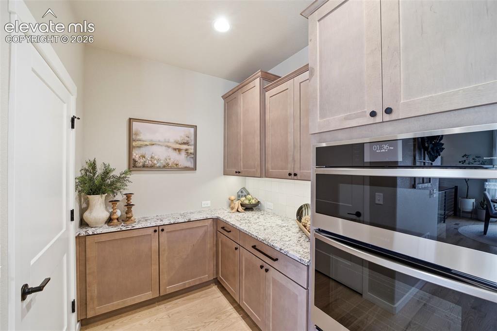 Image 10 of 49: Extended kitchen with pantry.