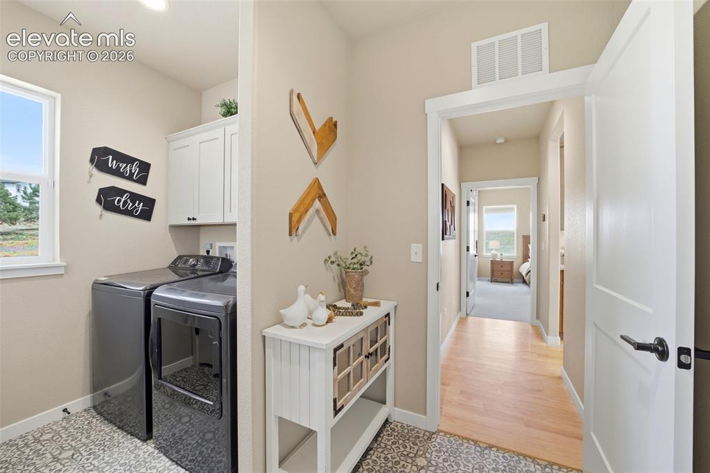 Image 24 of 49: Owners Entry / Laundry room from the garage was added when the home was bui