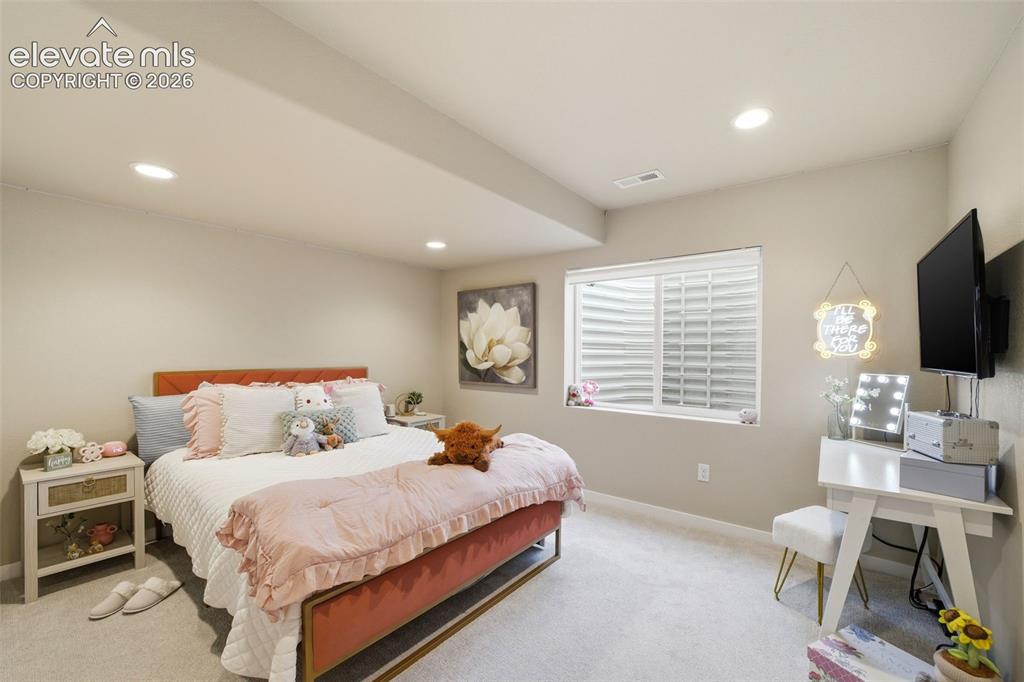 Image 34 of 49: Fifth bedroom in the basement is sizable and ready for your Pinterest ideas