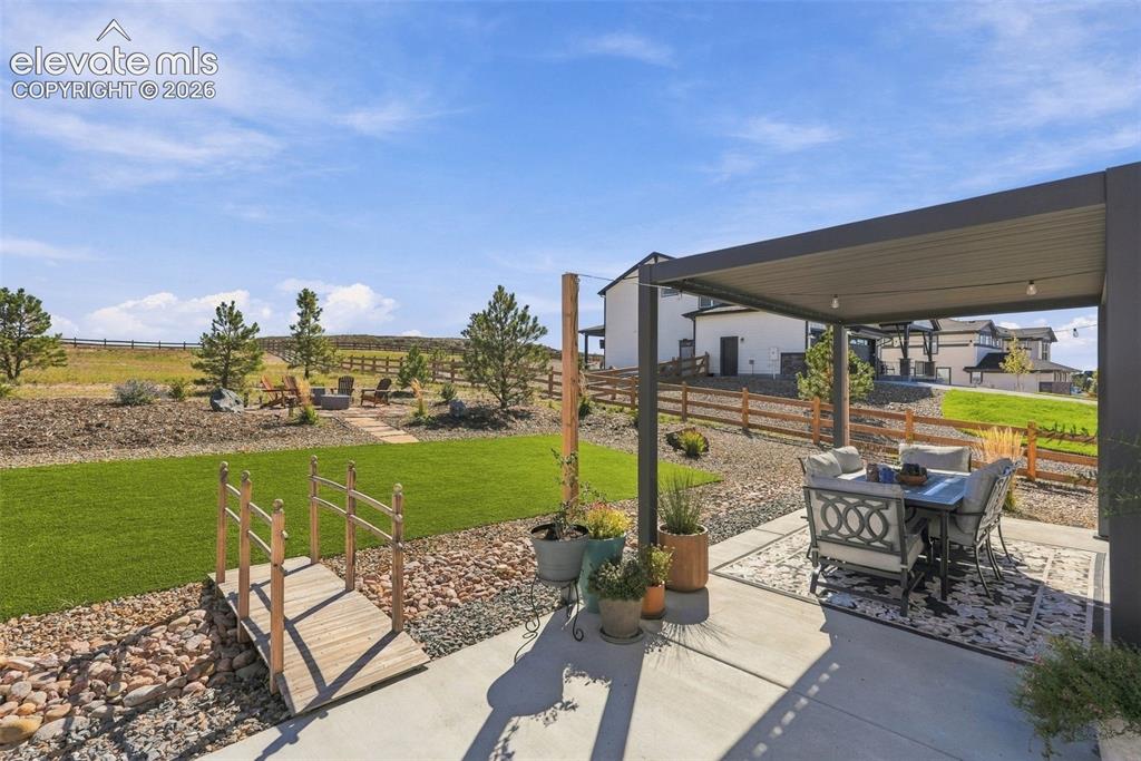 Image 36 of 49: Low maintenance acre with turf area & rock. Remaining acre is naturally gro