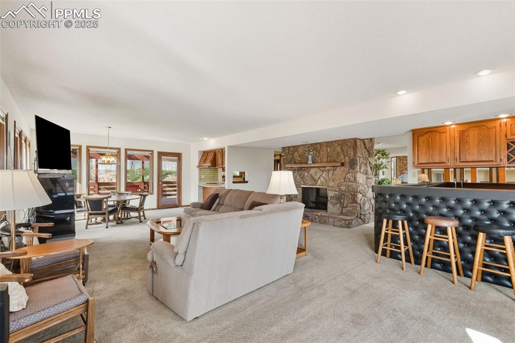 Image 40 of 48: Casual dining area by kitchen, with walk-out and wet bar