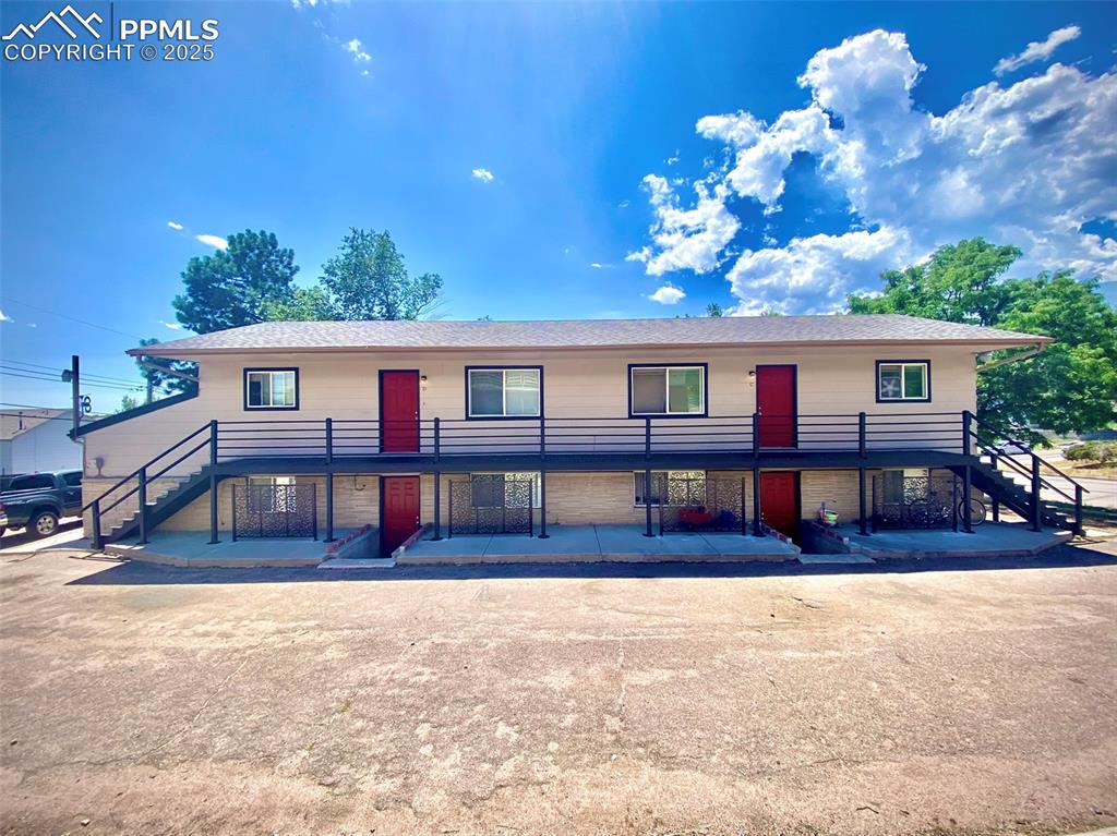 Caption: View of front of the 4 Plex with stairway.