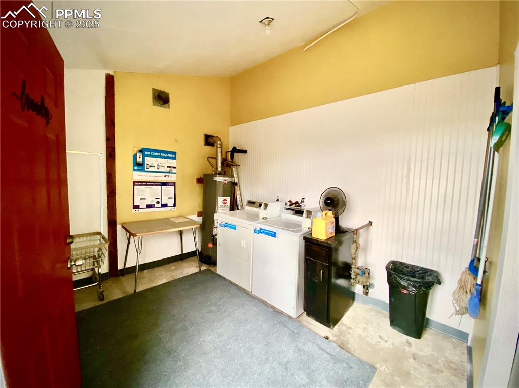 Image 3 of 28: Common Laundry area featuring washing machine and dryer