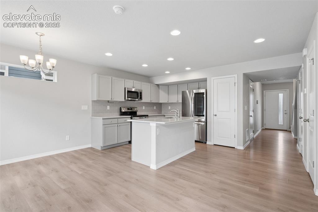 Image 11 of 36: The home beautifully presents with an open layout!