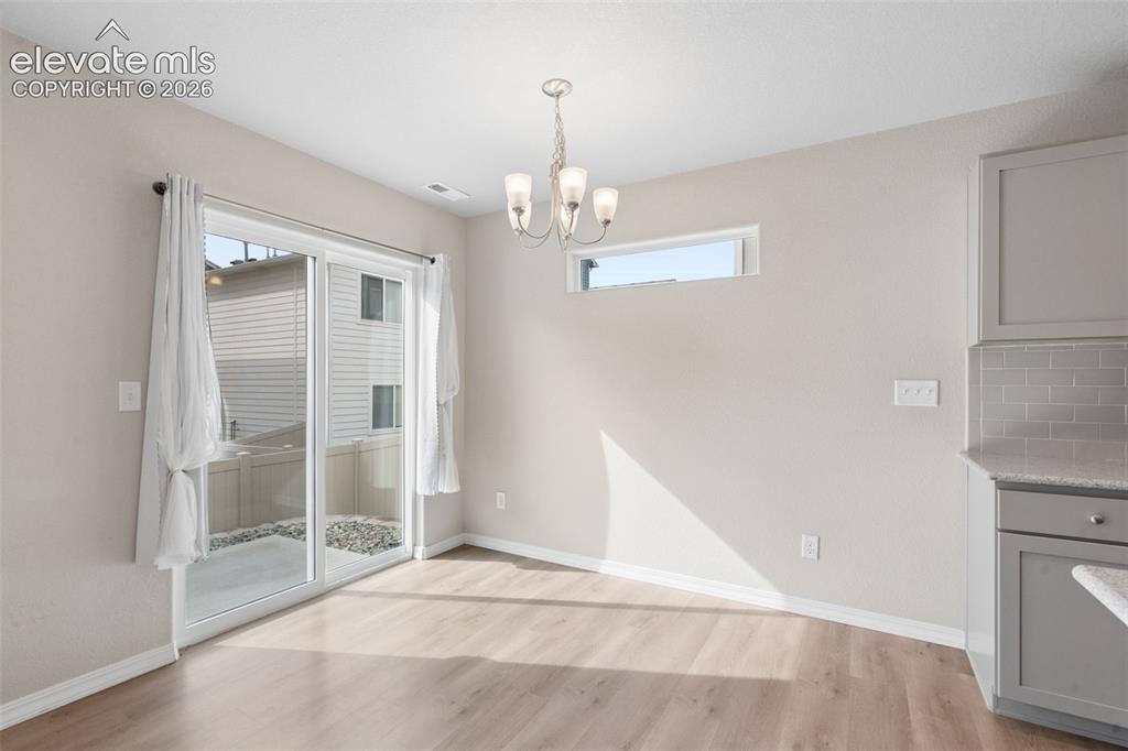 Image 13 of 36: The Dining Area is conveniently near the Kitchen and offers access to the h
