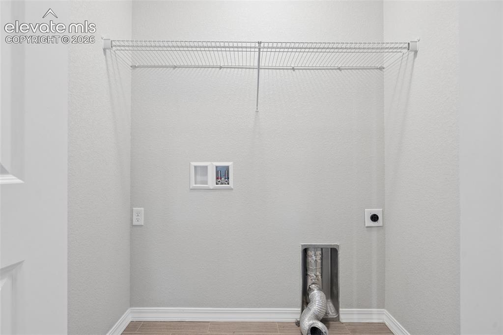 Image 21 of 36: Laundry is situated near bedrooms on the upper floor for ease of use!