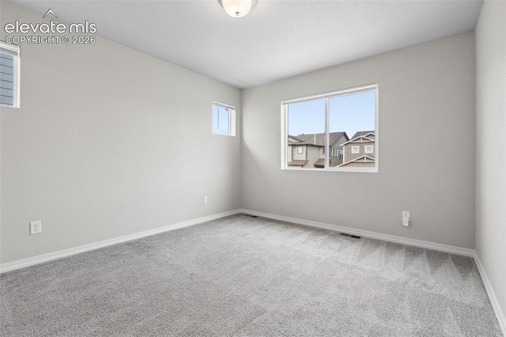 Image 22 of 36: The grand Primary Bedroom features an ensuite bathroom and a large walk-in 