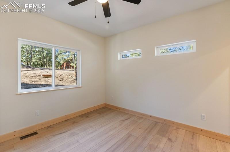 Image 31 of 37: Primary room at the front of the home featuring light wood-type flooring an