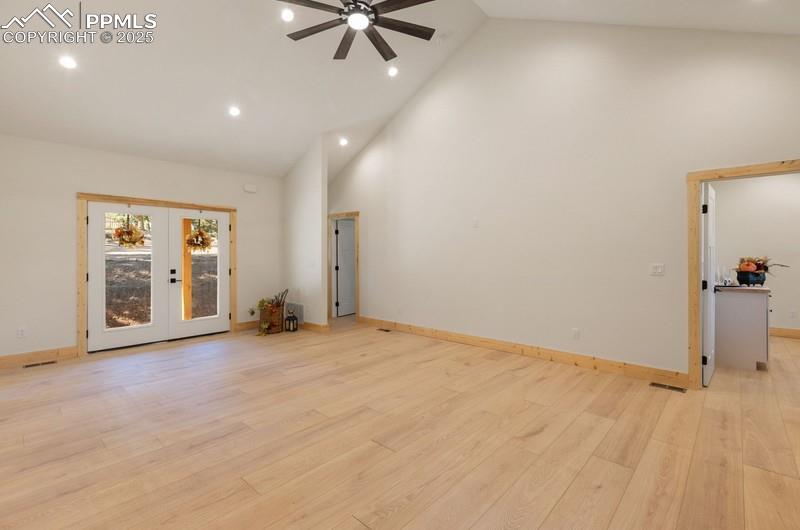 Image 9 of 37: Unfurnished room featuring high vaulted ceiling, recessed lighting, french 