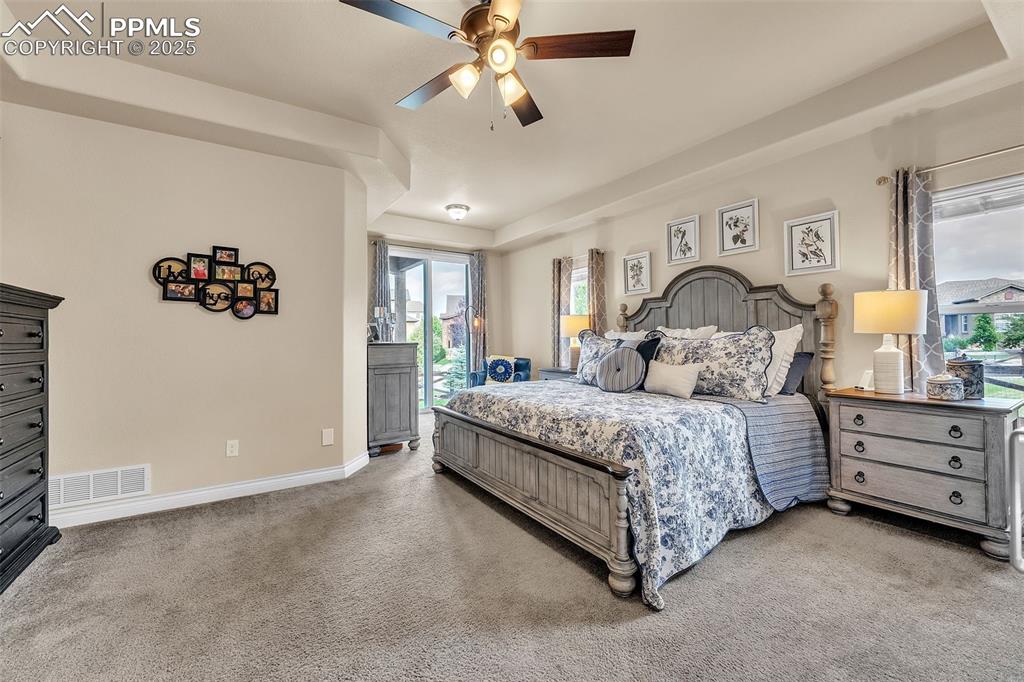 Image 14 of 40: Reading nook opens to lovely covered patio and backyard oasis 