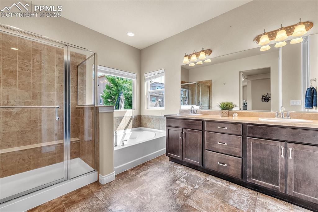 Image 15 of 40: Ample space in 5-piece bath with huge walk-in closest