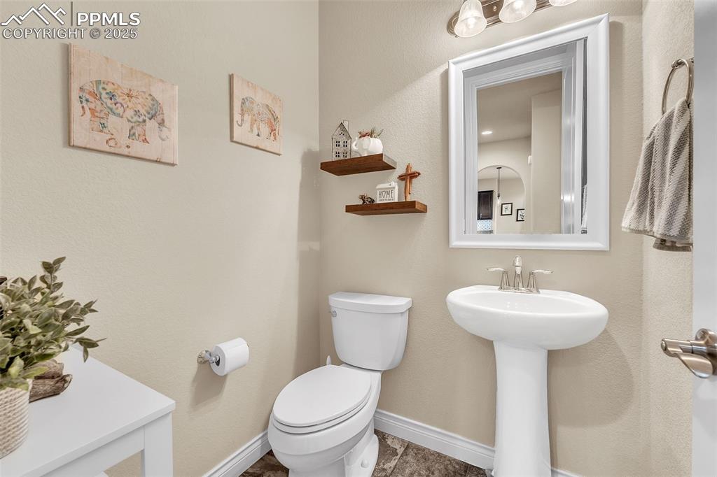 Image 17 of 40: Main floor powder room