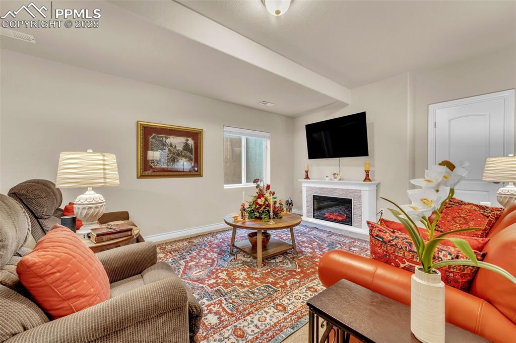 Image 26 of 40: Large living space provides options for game room, theater or work out area