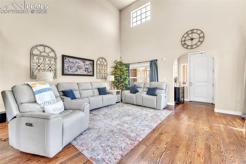 Image 4 of 40: Vaulted ceilings and lots of light coming through the high transom windows