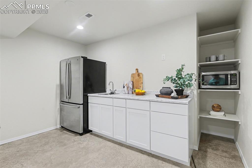 Image 27 of 30: Wet Bar in basement