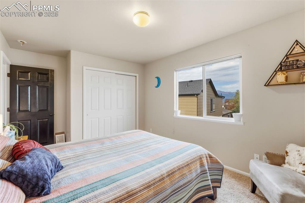 Image 26 of 46: Bedroom #4 upstairs has mountain views.