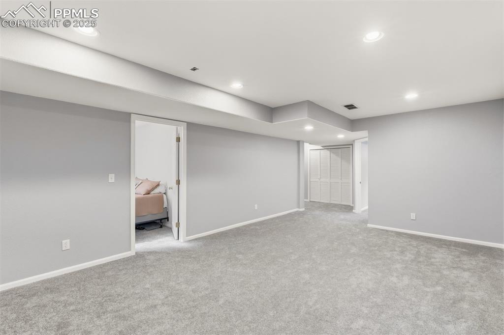 Image 28 of 46: Full basement features a large Family Room with new carpeting.