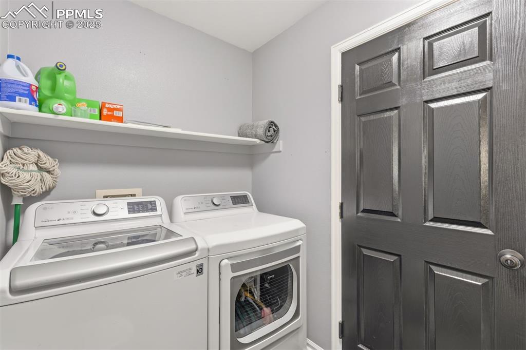 Image 34 of 46: The Laundry room is located off the garage on the main level.