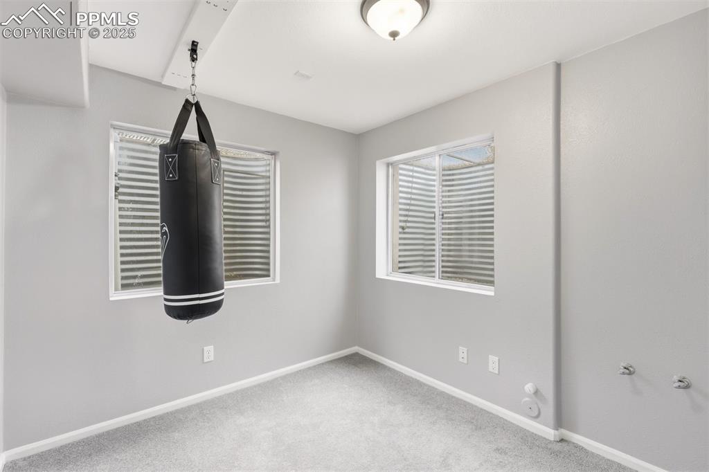 Image 36 of 46: Potentially a 7th bedroom. This room has a closet and is plumbed for a sink