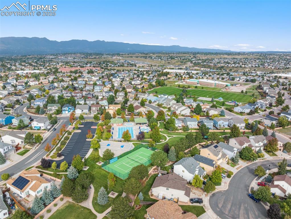 Image 41 of 46: The neighborhood pool and tennis courts are within walking distance and inc