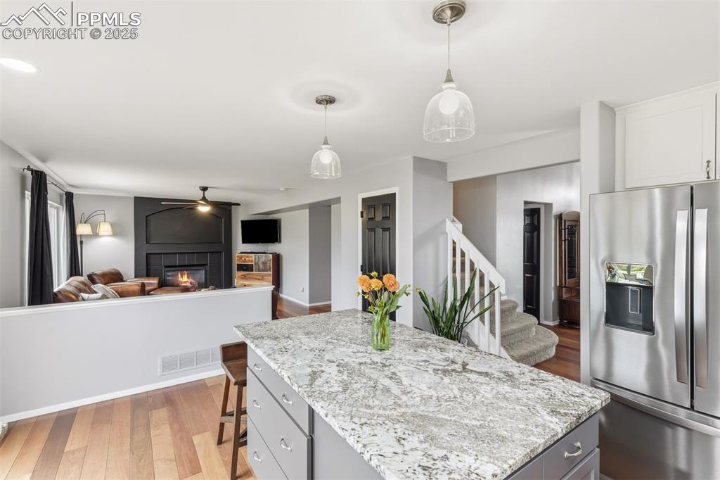 Image 8 of 46: Open concept kitchen & living room.