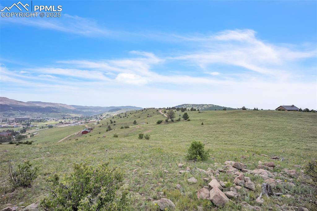Image 4 of 9: View of mountain backdrop with rural landscape