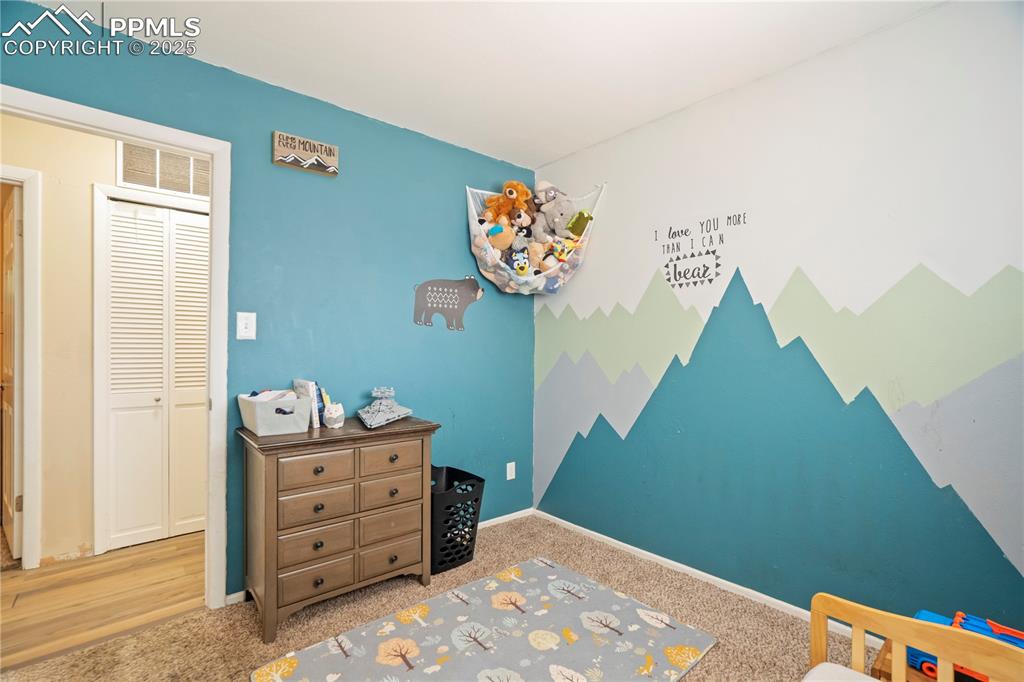 Image 15 of 22: Carpeted bedroom with a closet and baseboards