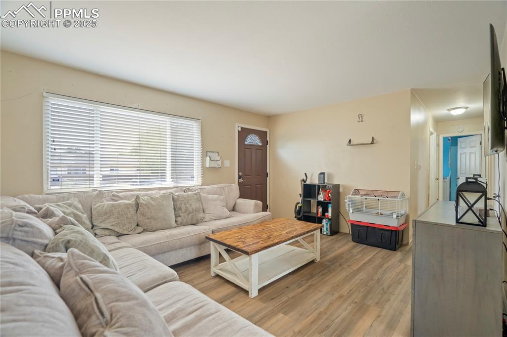 Image 22 of 22: Living area featuring light wood-style flooring