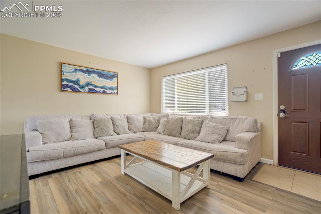Image 5 of 22: Living area featuring light wood-style flooring
