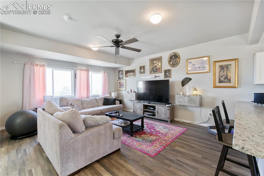 Image 12 of 36: Good size living room off of kitchen.