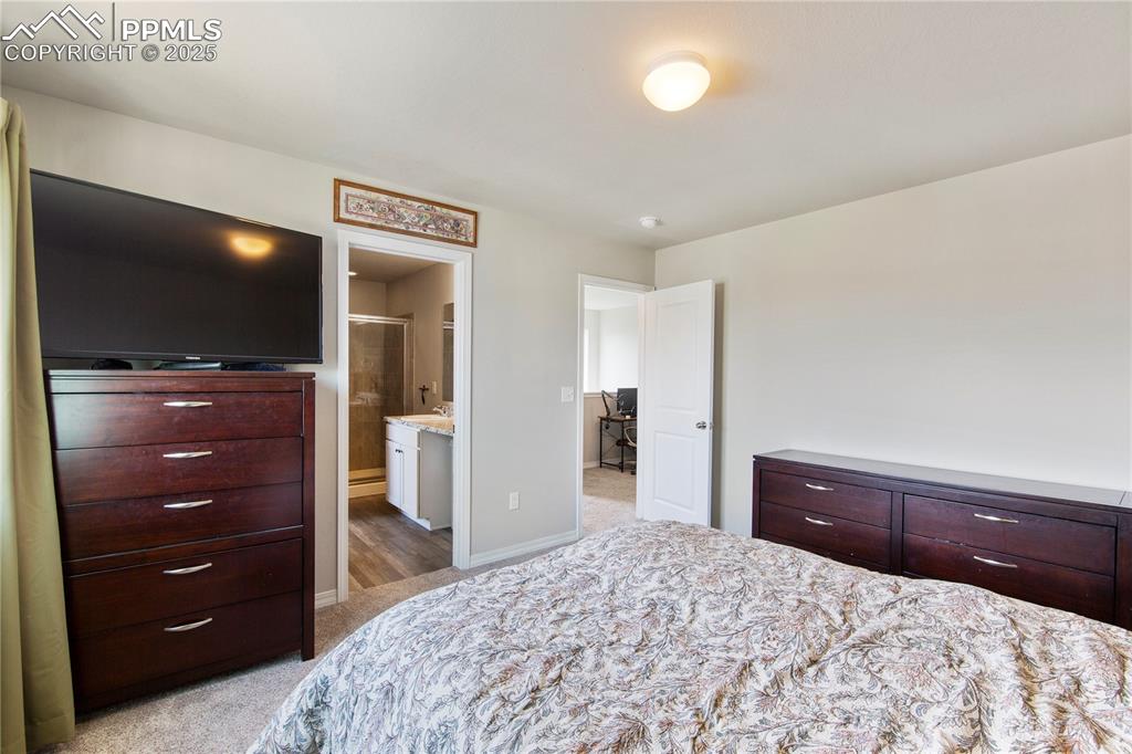 Image 16 of 36: Primary bedroom has a separate attached 3/4 bth.