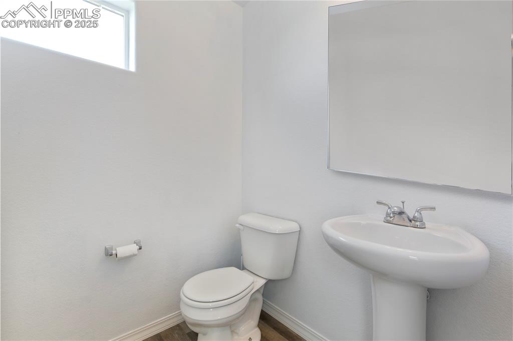 Image 22 of 36: 1/2 bath on the main level.