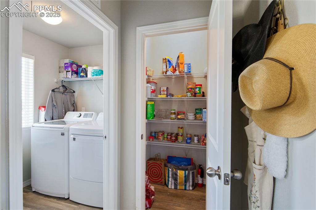 Image 23 of 36: Separate laundry and large pantry on main level.
