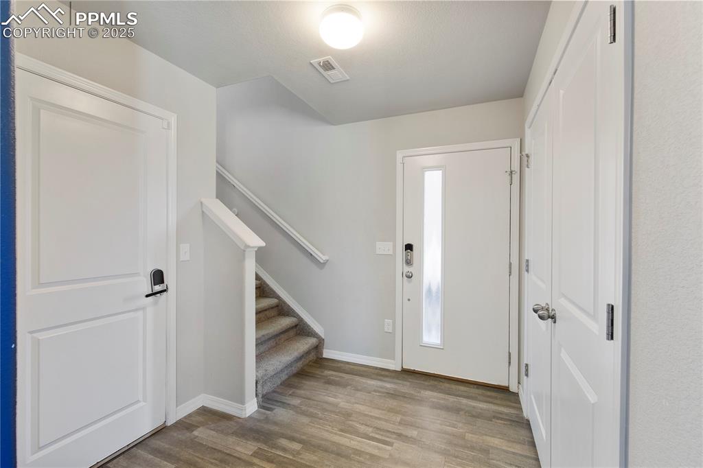 Image 4 of 36: Coat closet as you enter the home.