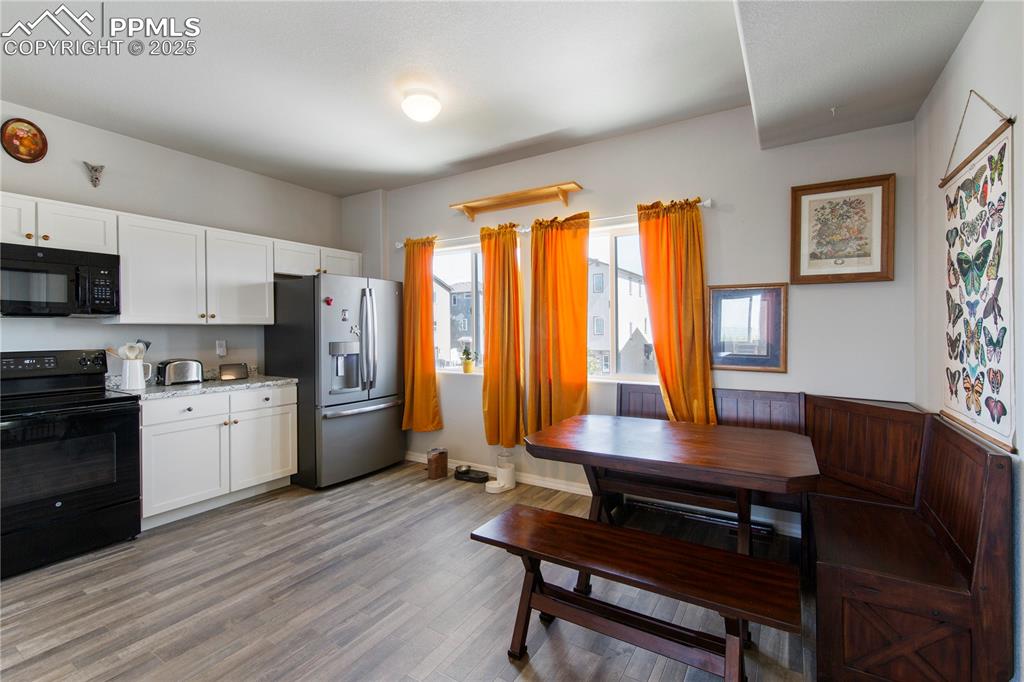 Image 9 of 36: Large eat in kitchen.