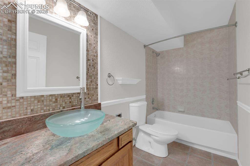 Image 32 of 43: Full bathroom featuring shower/tub combo