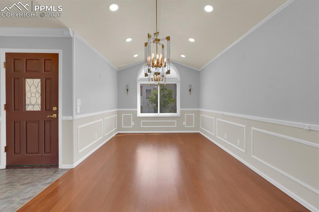 Image 4 of 43: Entryway featuring formal dining room