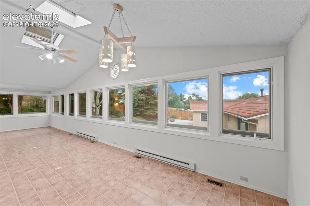 Image 12 of 43: Stunning Pikes Peak view from this wall of Pella windows!