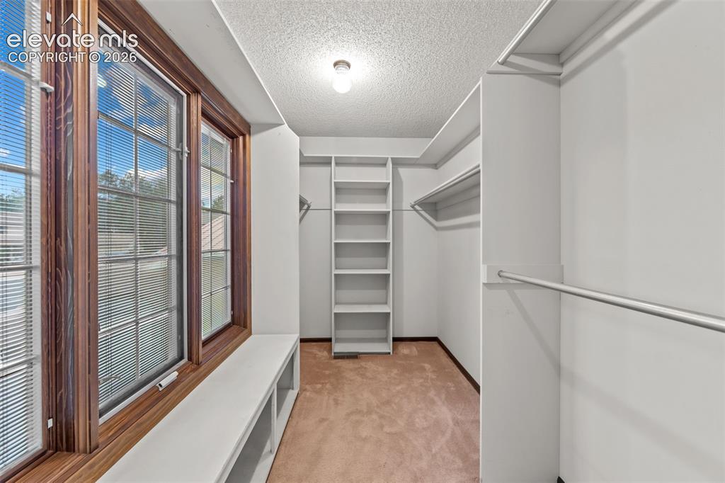 Image 17 of 43: primary bedroom 6x14 walk in closet