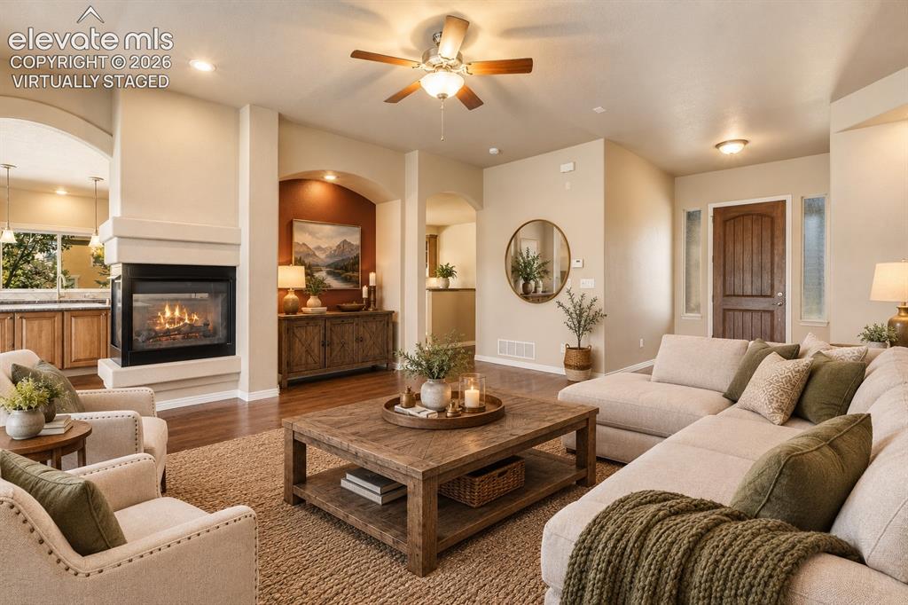 Image 10 of 50: VIRTUALLY STAGED - LIVING ROOM WITH FIREPLACE