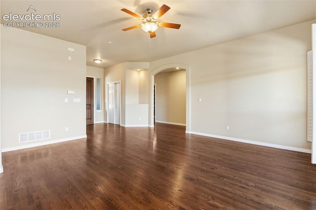 Image 12 of 50: LIVING ROOM HAS BEAUTIFUL HARDWOOD FLOORS