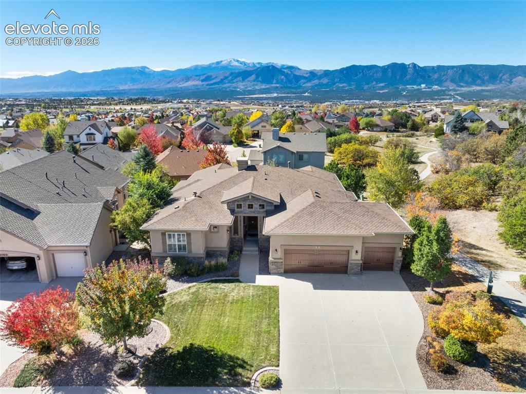 Image 2 of 50: AERIAL VIEW OF THIS STUNNING RANCH HOME WITH AMAZING PIKES PEAK VIEWS IN BE